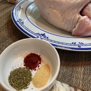 Add onion to turkey cavity and season with spices and olive oil
