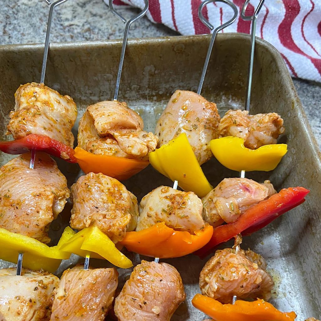 Chicken and vegetables on skewers ready to grill