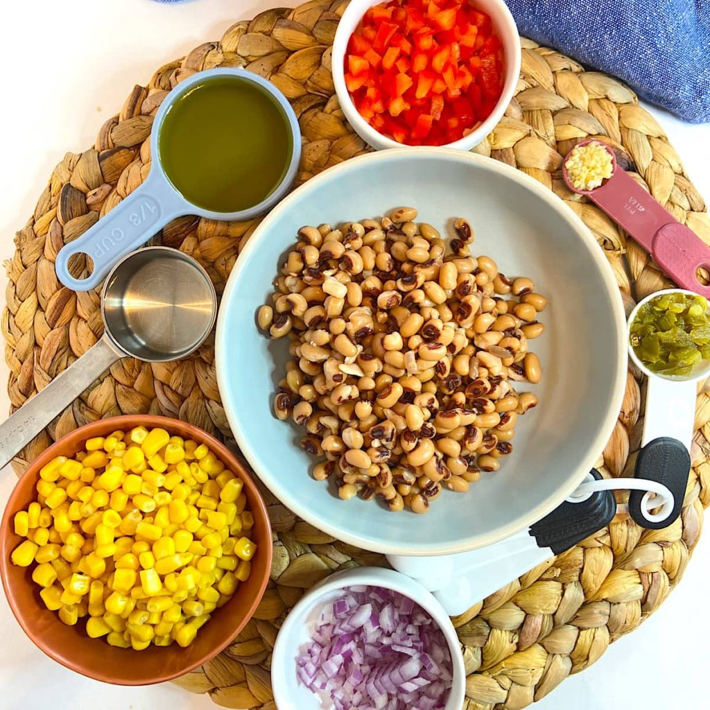 spread of measured ingredients for corn and black eyed pea dip
