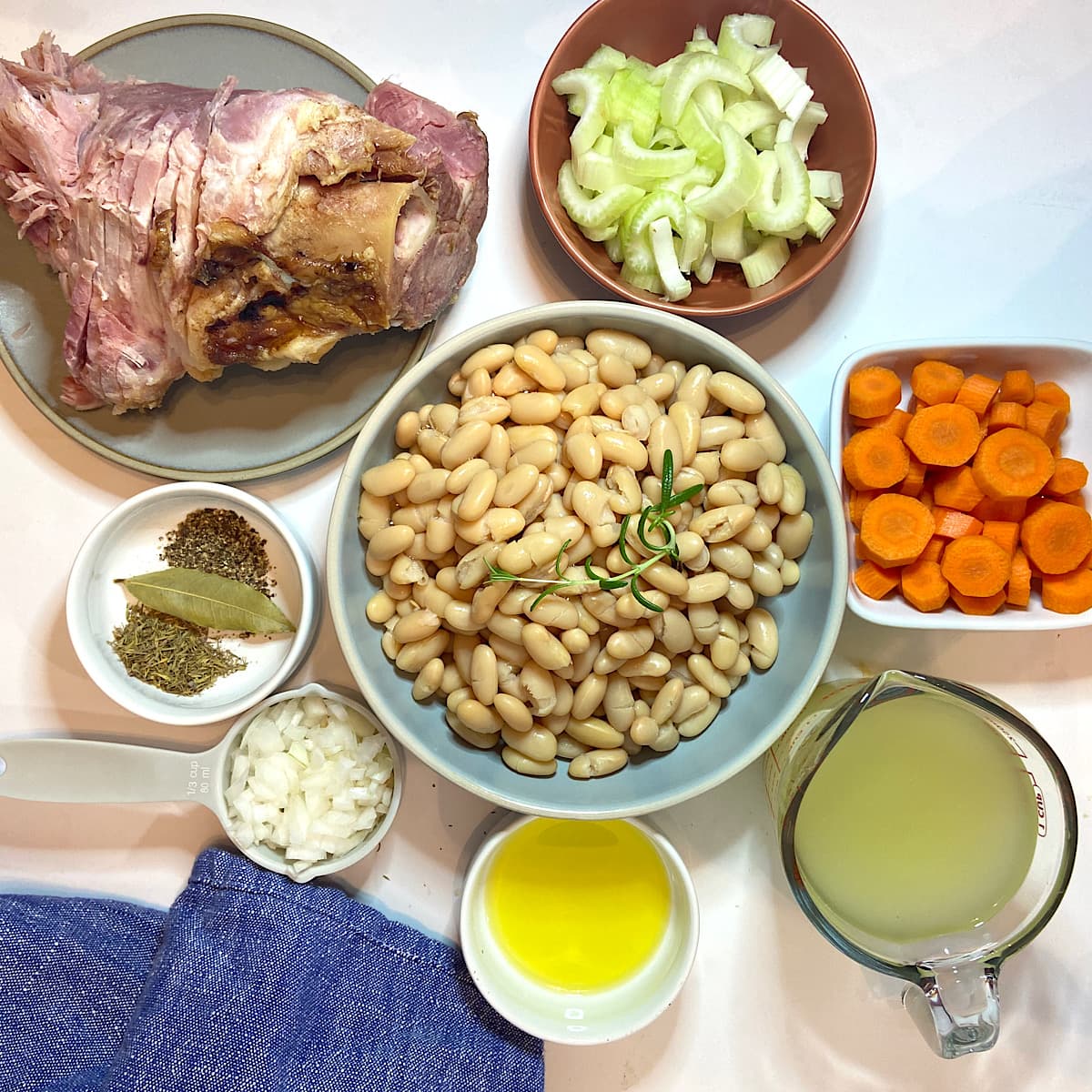 spread of measured ingredients for ham and bean soup recipe.