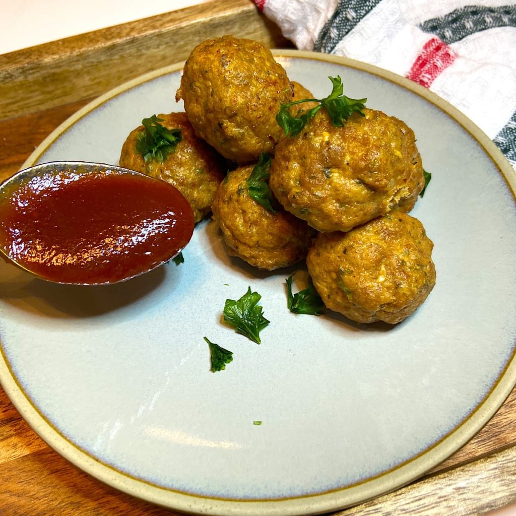 Tasty Mediterranean Meatballs on plate with sauce.