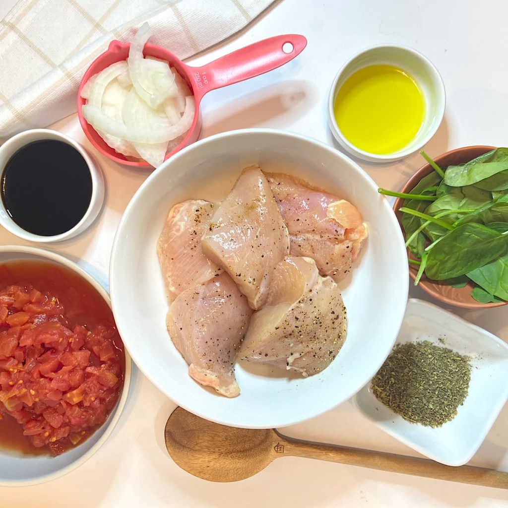 Spread of measured ingredients for balsamic chicken breasts