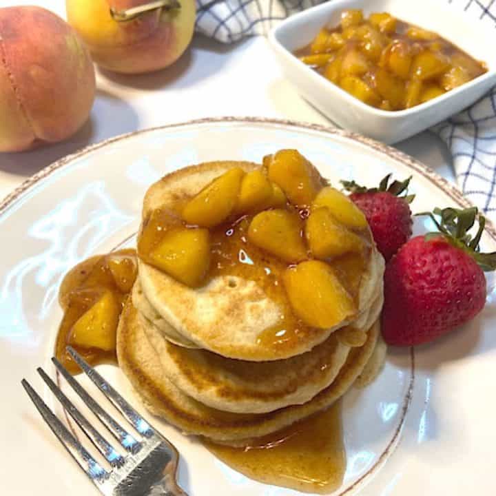 healthy pancakes on plate with fruit sauce