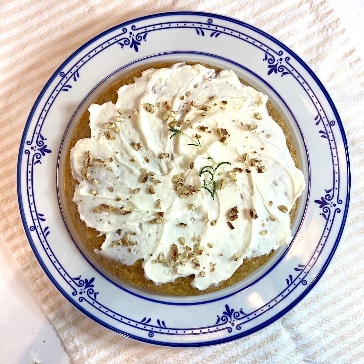 Top view of Iced carrot cake on plate