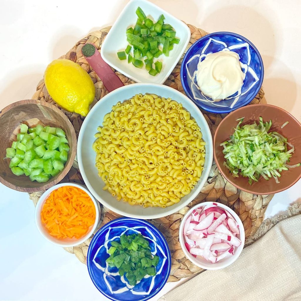 spread of measured ingredients for vegetable pasta salad