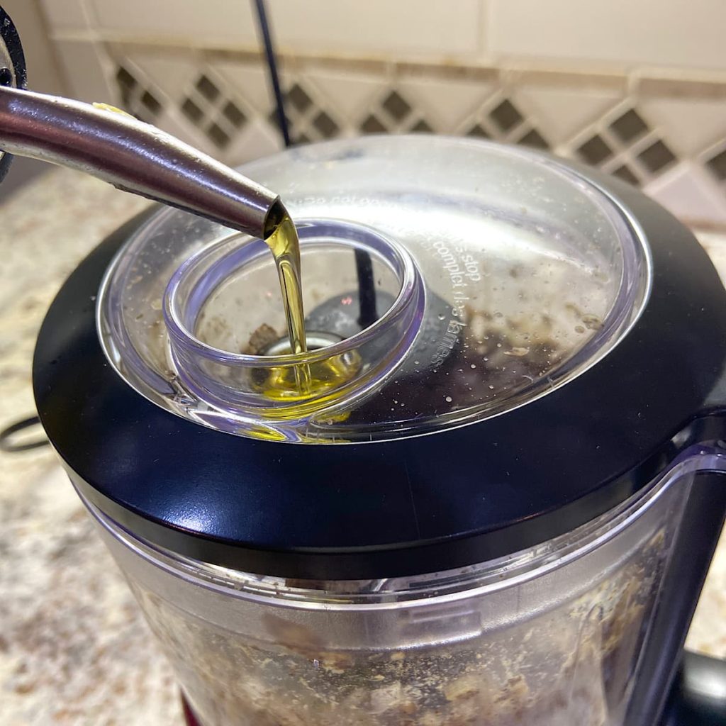 drizzle in olive oil and vinegar to pouring consistency