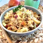 bowl of rice pilaf recipe with apples, celery, pecan, and raisins