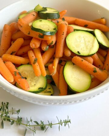 bowl of baby carrots and zucchini