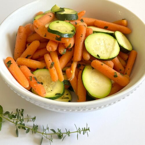 bowl of baby carrots and zucchini