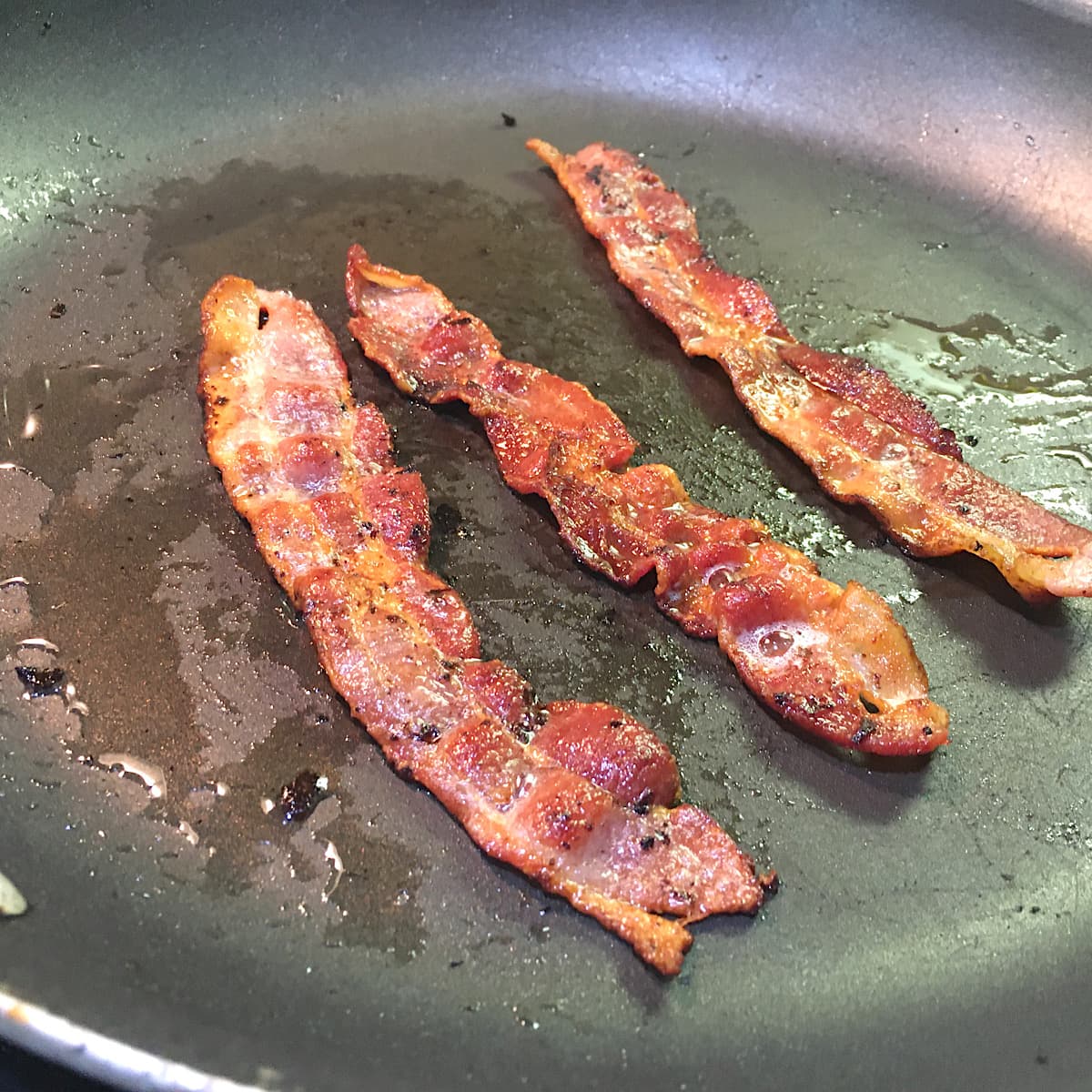 3 strips of fried bacon.