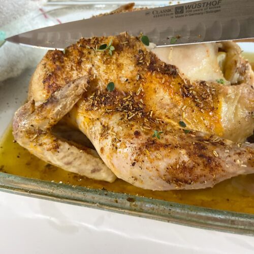 oven roasted chicken in baking dish ready to serve