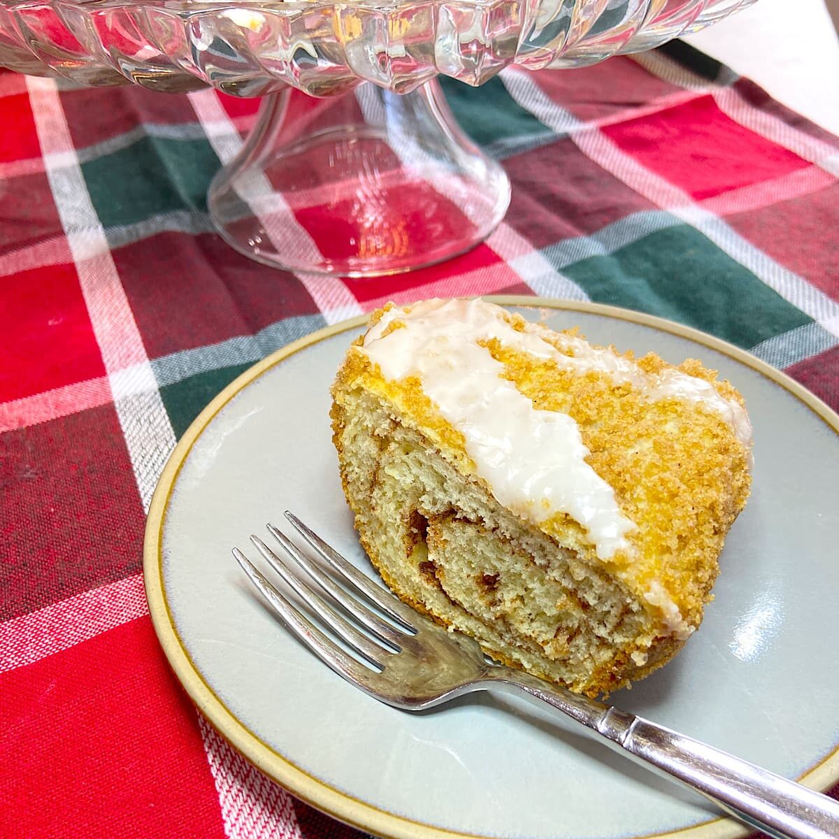 slice of cinnamon roll coffee cake on a plate.