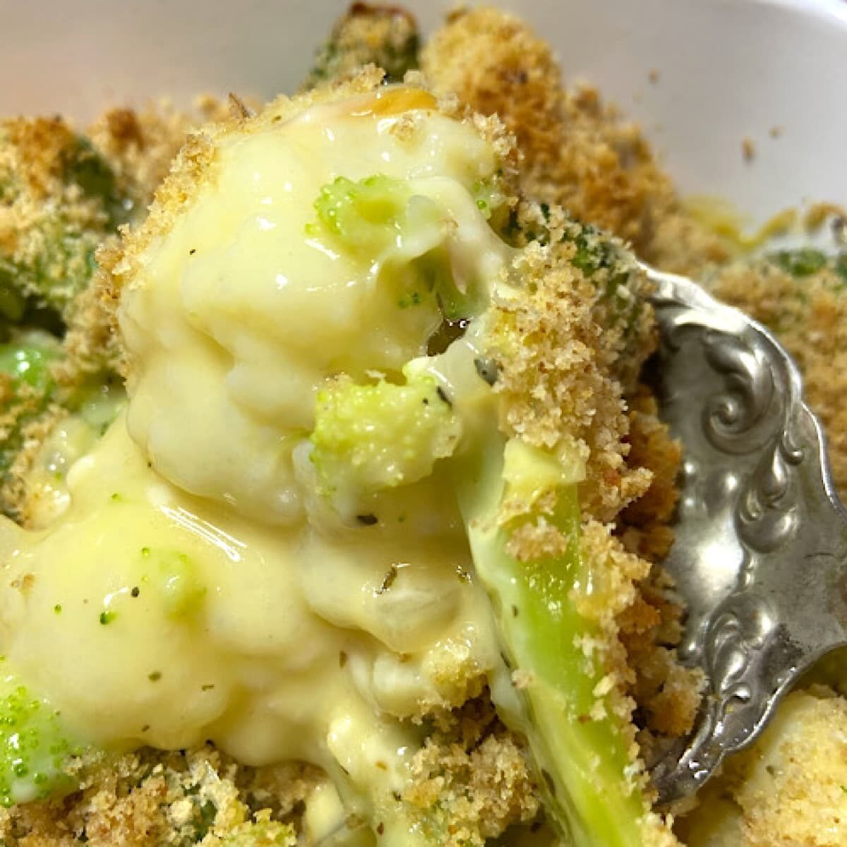 broccoli in cheese sauce with bread crumbs.