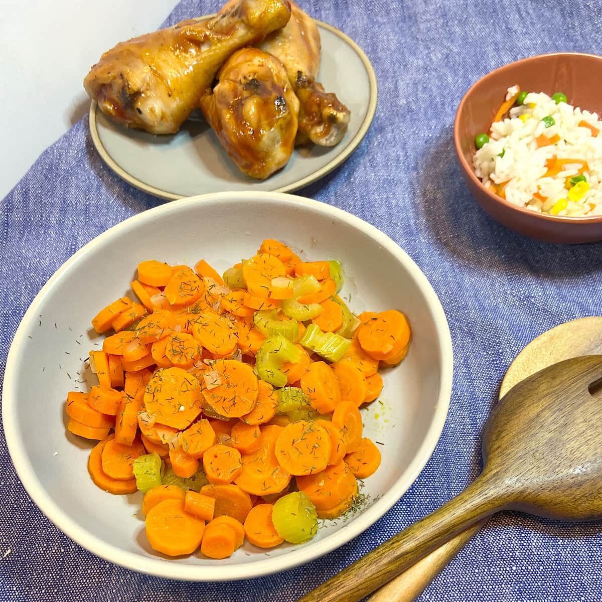 Bowl of carrots and celery on table ready to serve.