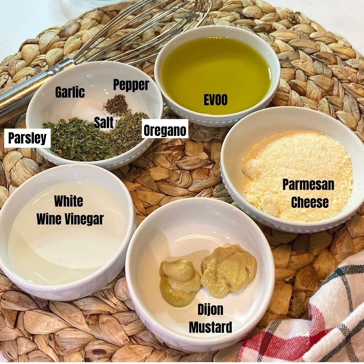 spread of measured ingredinets for olive oil salad dressing.