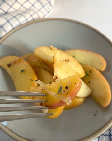 Simple sauteed apples and leeks on plate