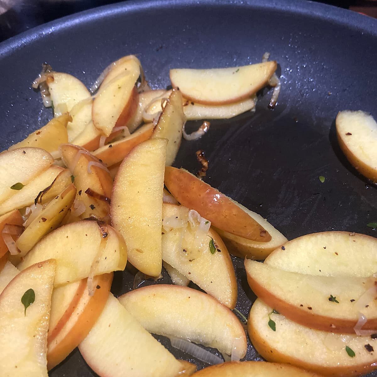 Add sliced apples and spices.