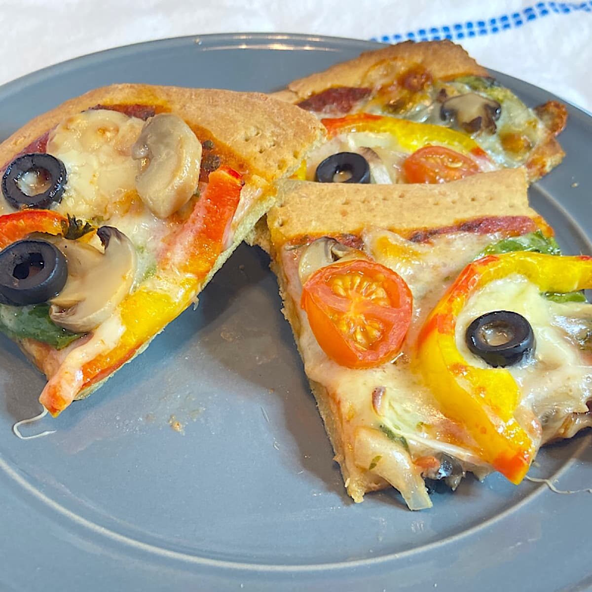 slice of whole wheat thin crust pizza