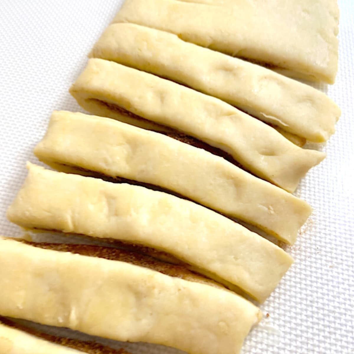 cinnamon roll dough cut into strips