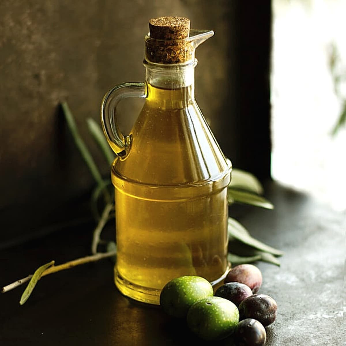 bottle of olive oil on table.