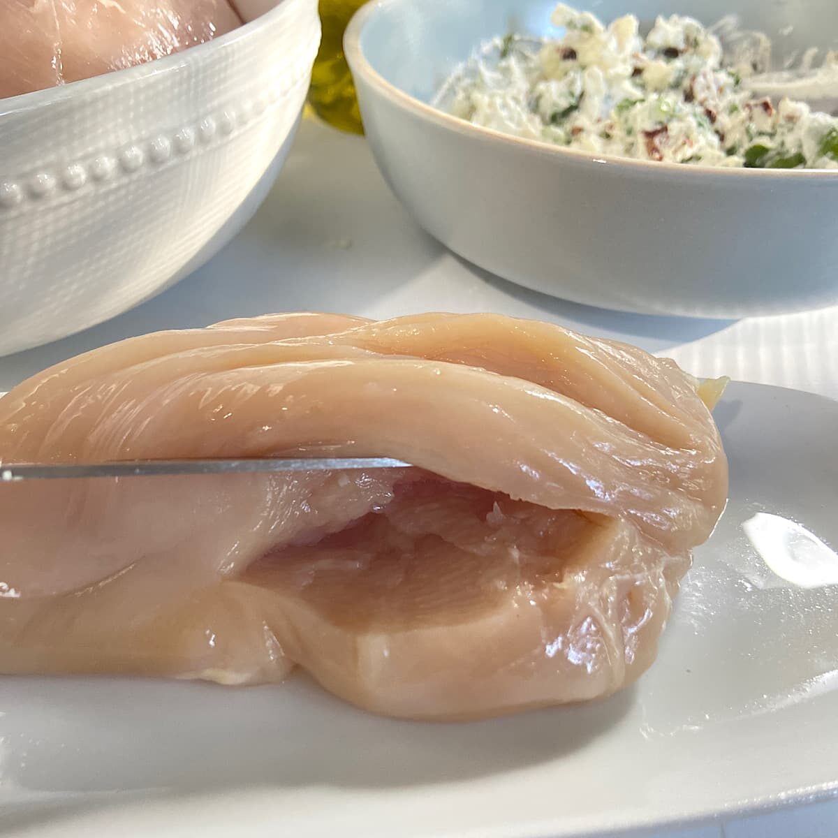 Cut a horizontal pocket in chicken breast