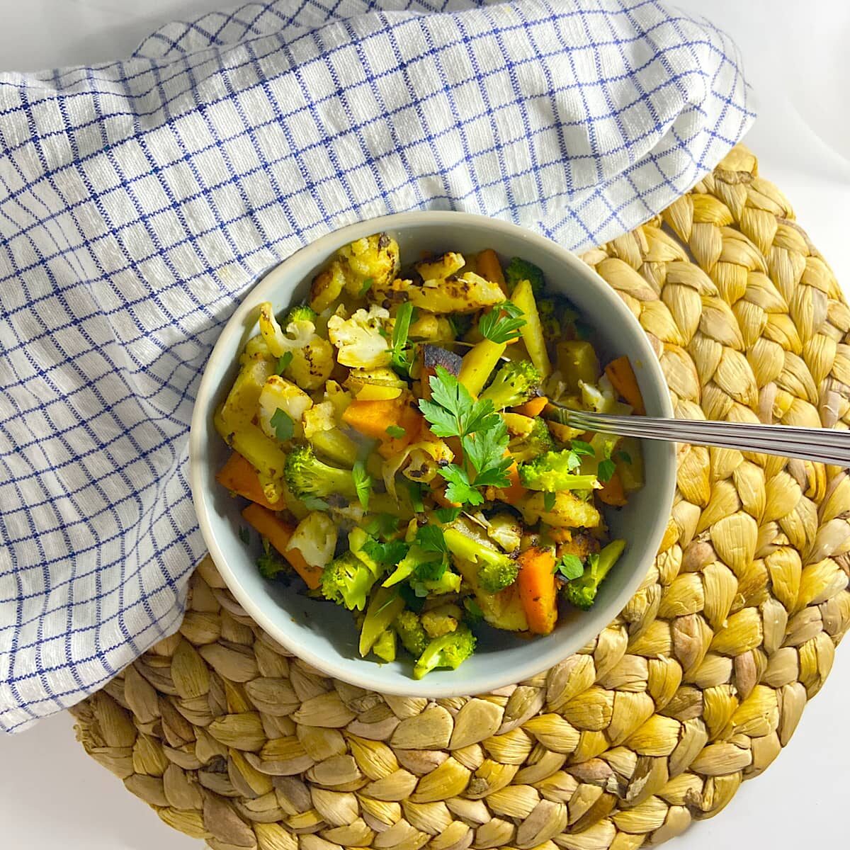 bowl of sauteed broccoli, cauliflower, and potatoes