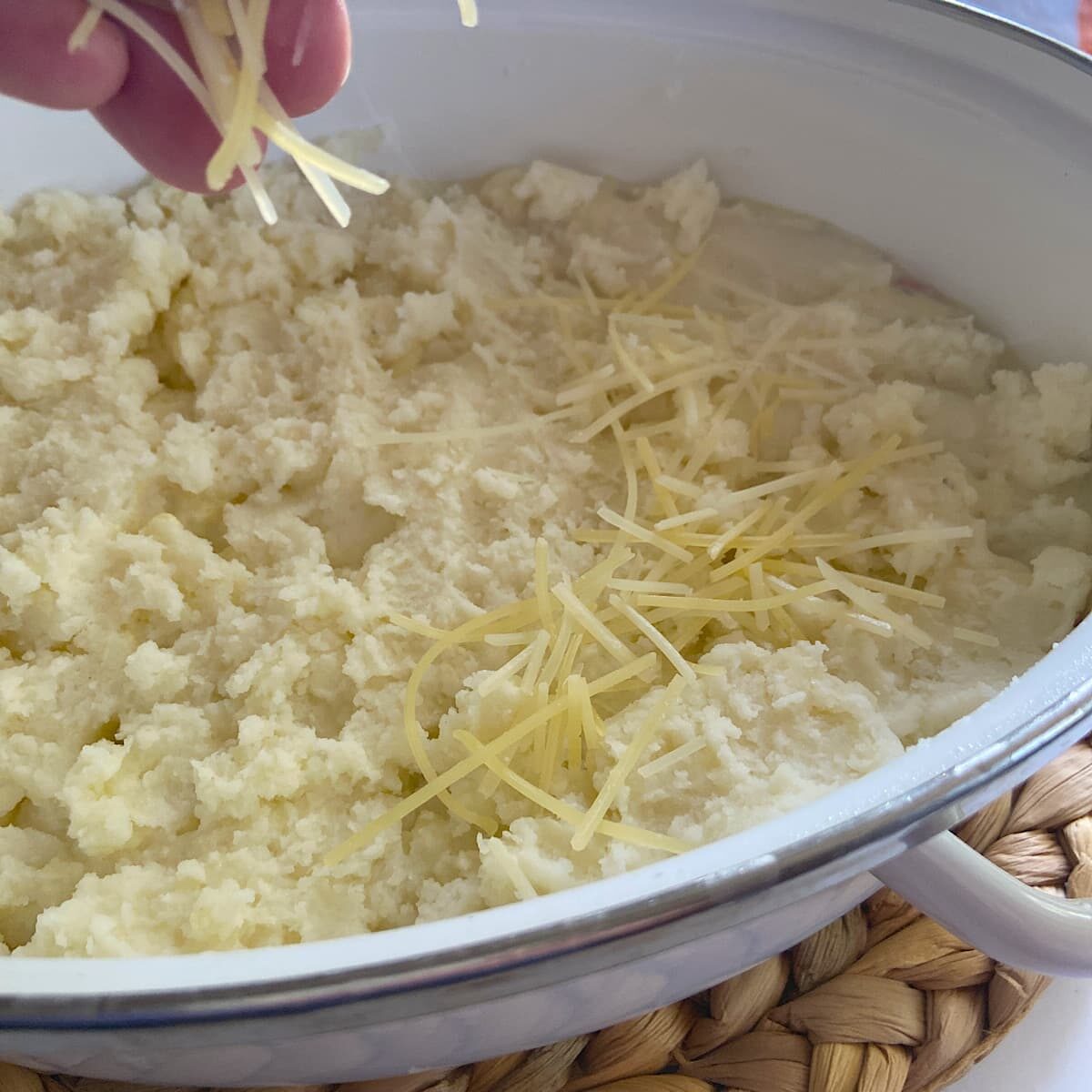 sprinkle shaved parmesan cheese over mashed potatoes.