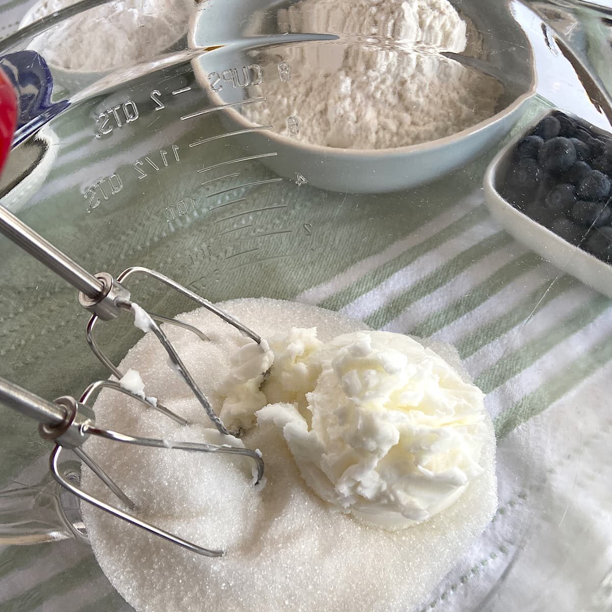 cream shortening and sugar in a bowl with hand mixer.