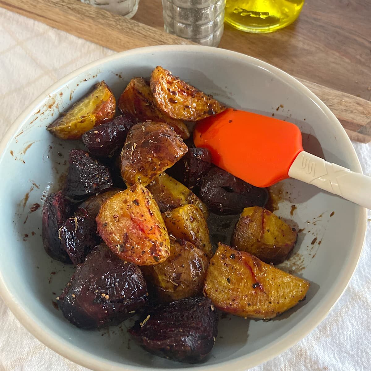 Toss roasted beets with vinaigrette
