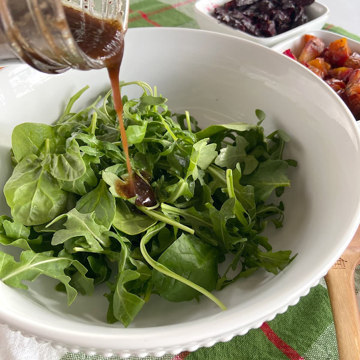 Drizzle greens with dressing