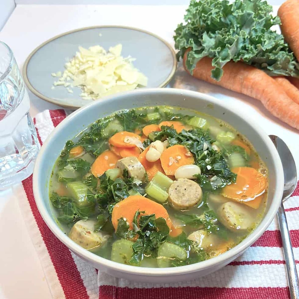 Bowl of hot chicken sausage kale soup 