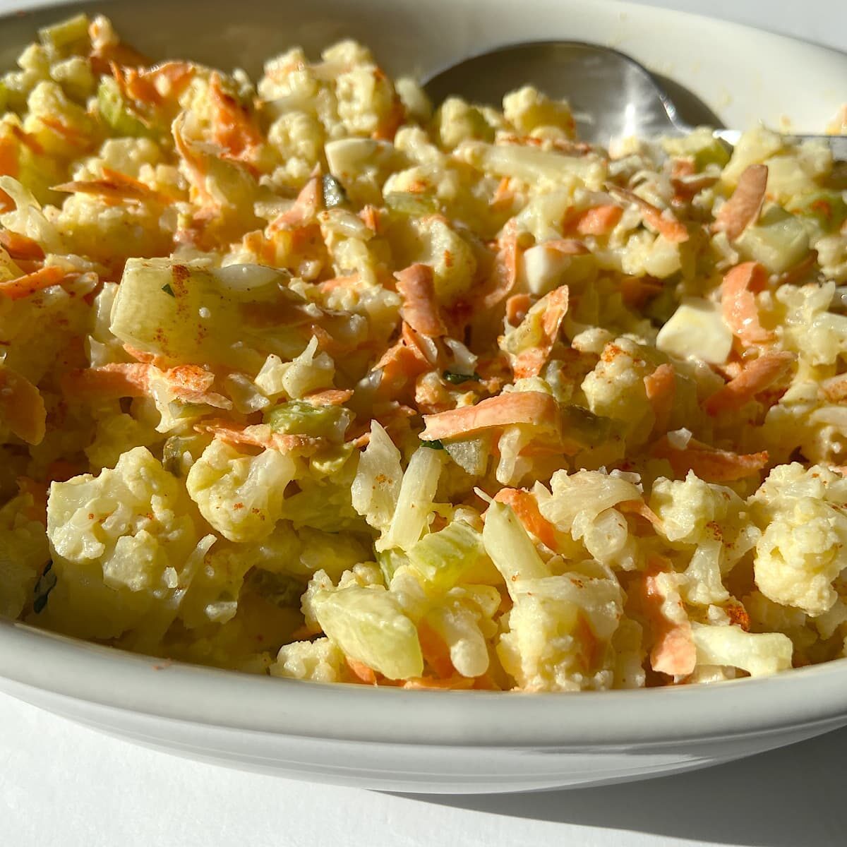 cauliflower potato salad in a serving dish