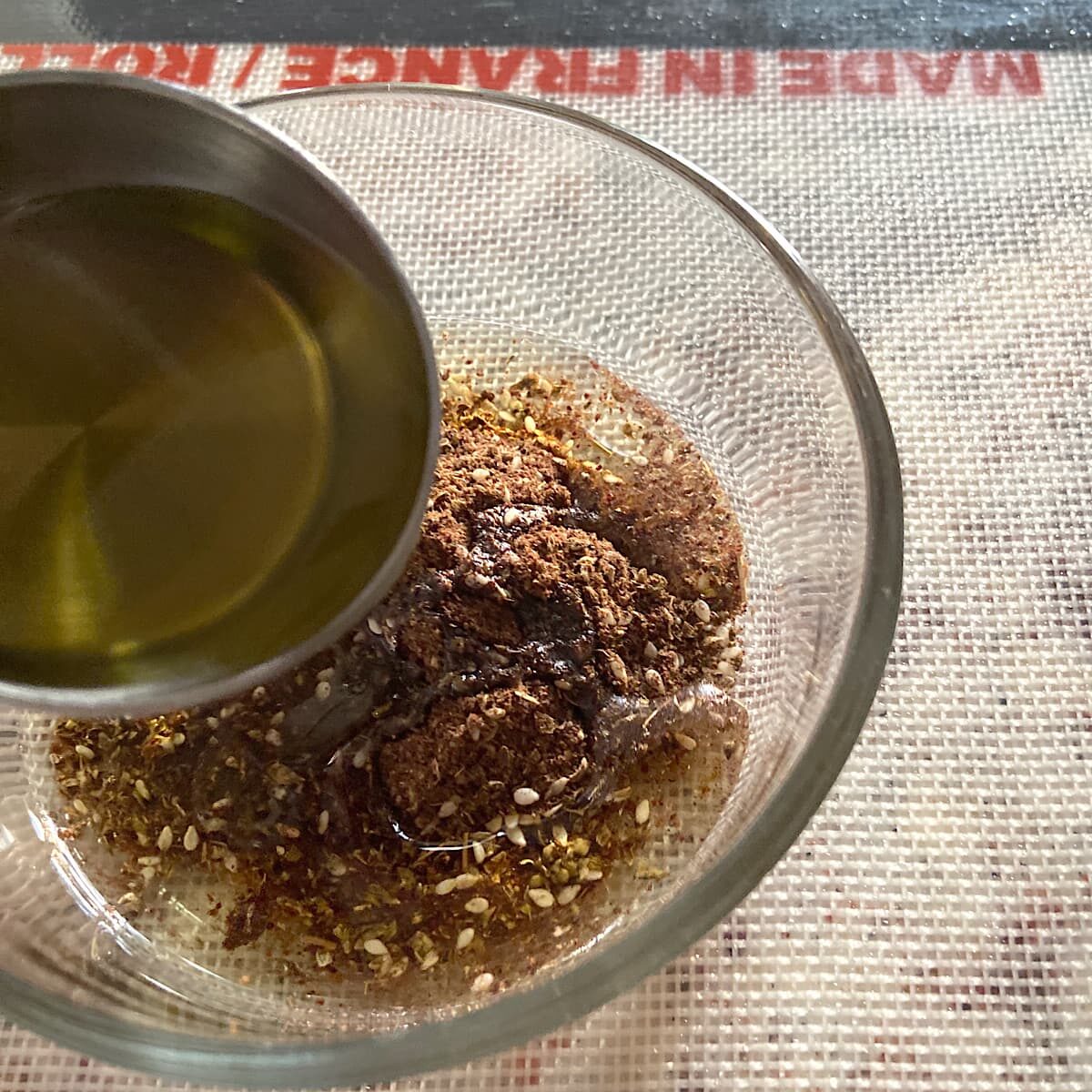 zaatar spice mix and live oil in a bowl.
