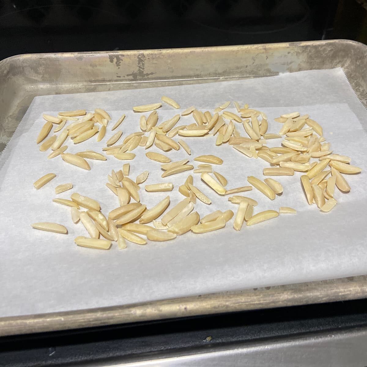 picture of toasted slivered almonds on a baking tray.