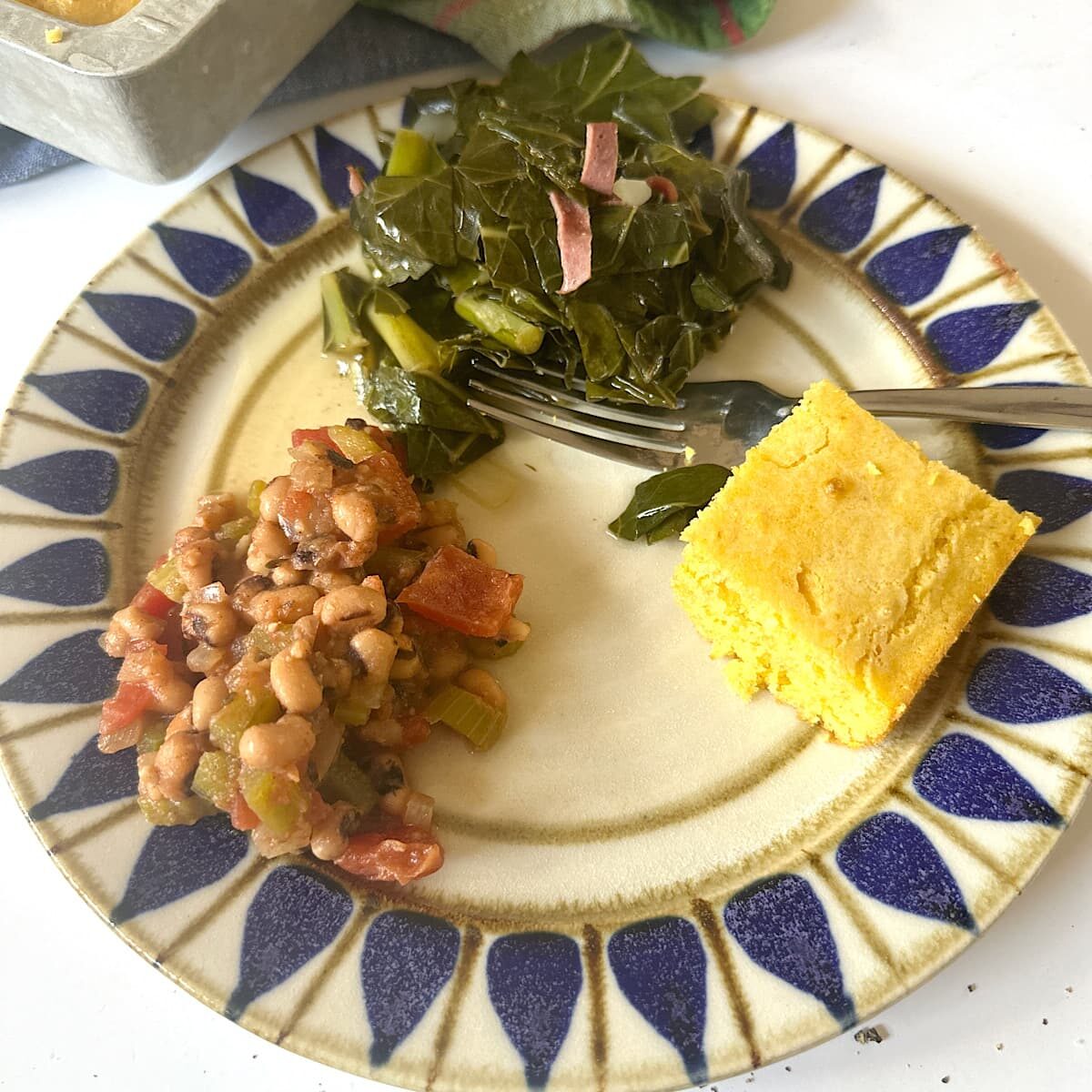 Picture of Creole black eyed peas, collard greens, and cornbread.