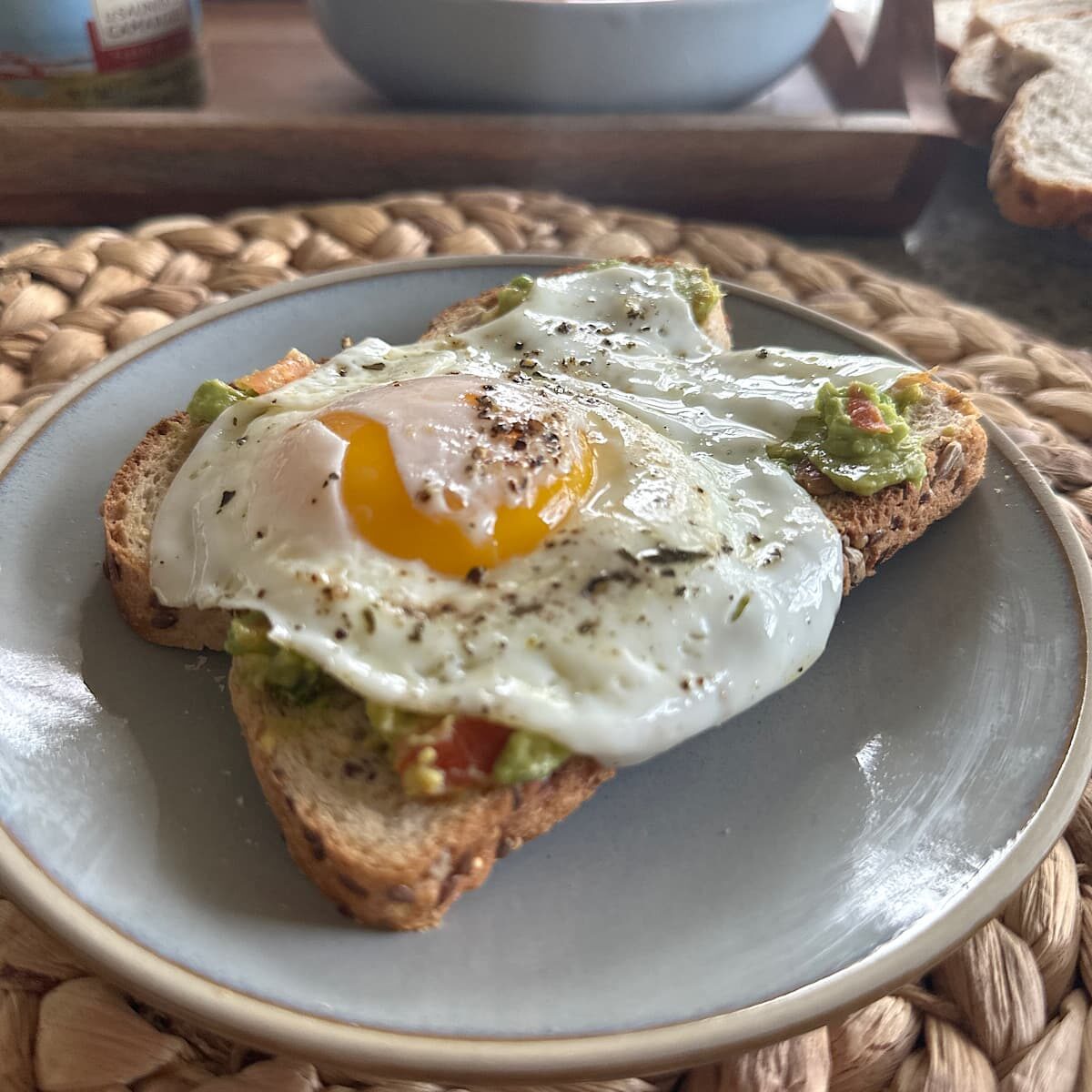 Picture of over easy egg on toast and smashed avocado.