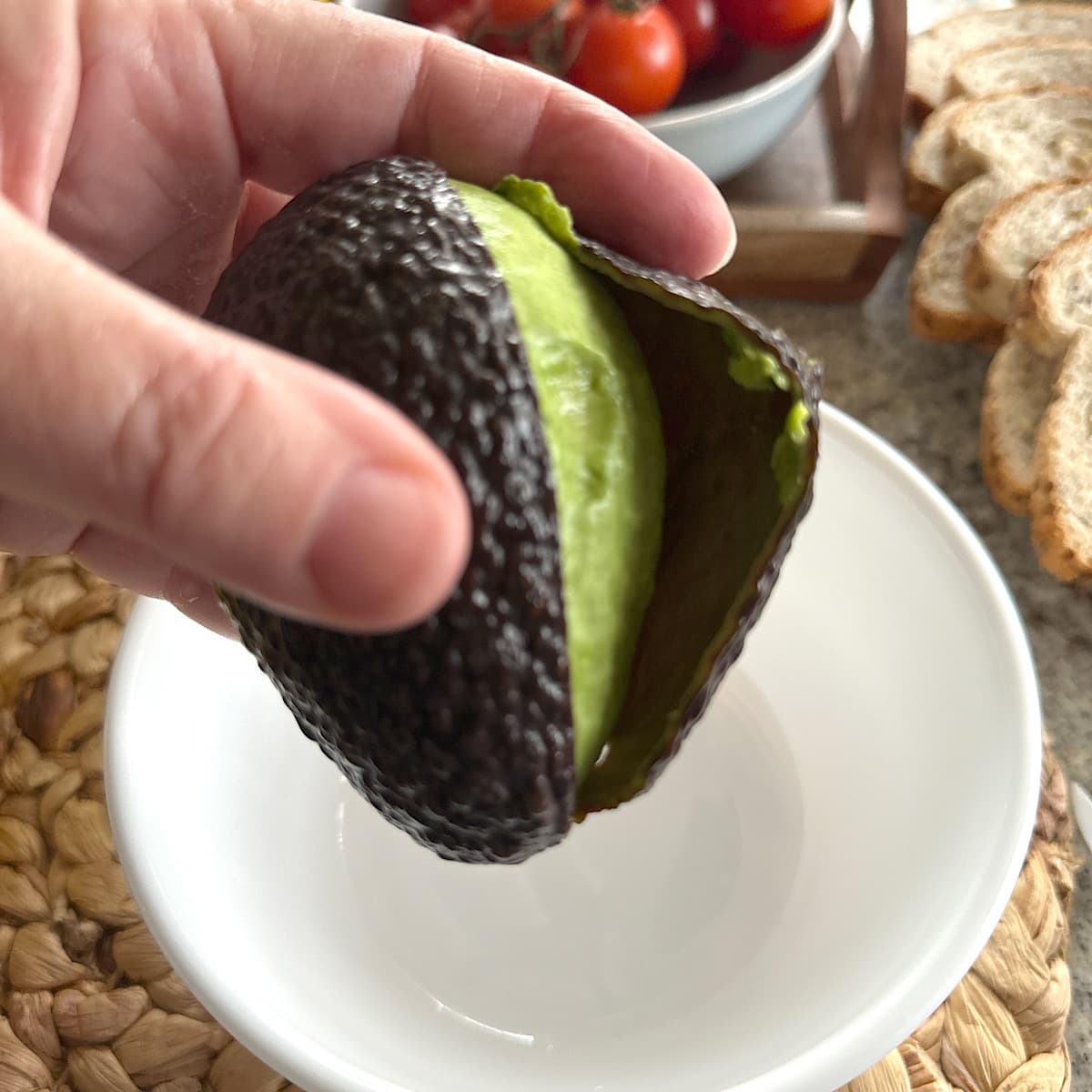 picture of an avocado with cut, loosened skin.